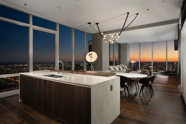 a large kitchen with a table and chairs