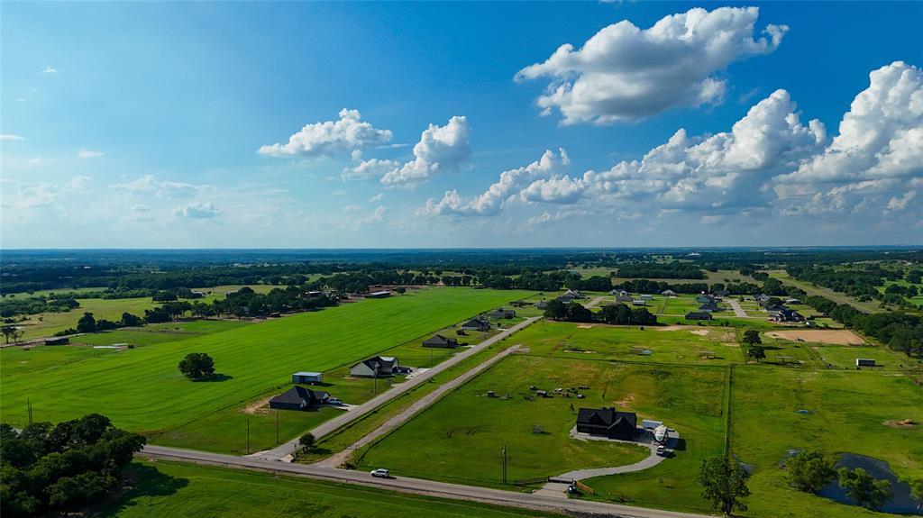 1160 Doss Road Millsap, TX 76066 - Photo 3 of 24 a view of a golf course with a yard
