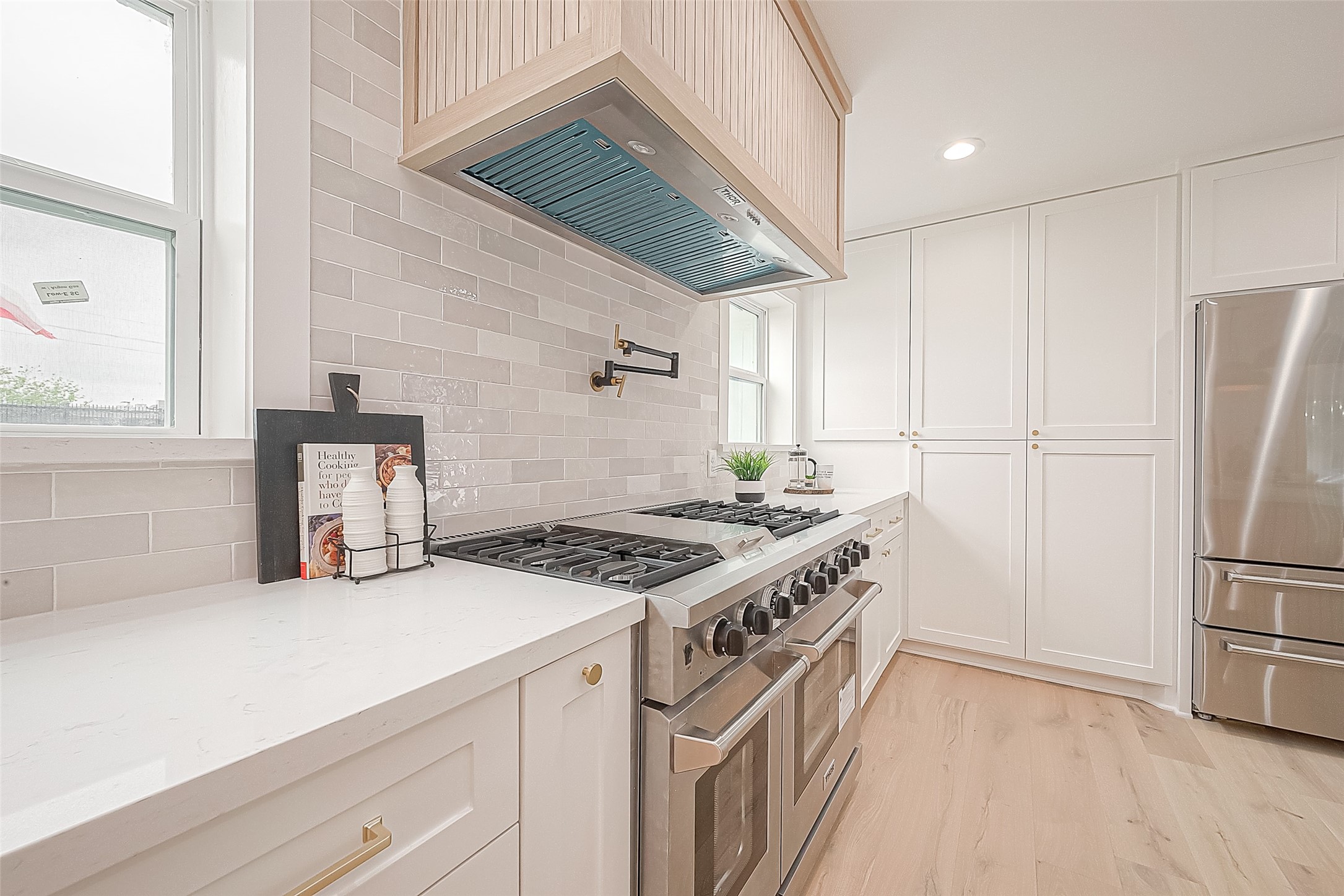 6254 Locke Lane Houston, TX 77057 - Photo 13 of 44 a kitchen with a stove and a refrigerator