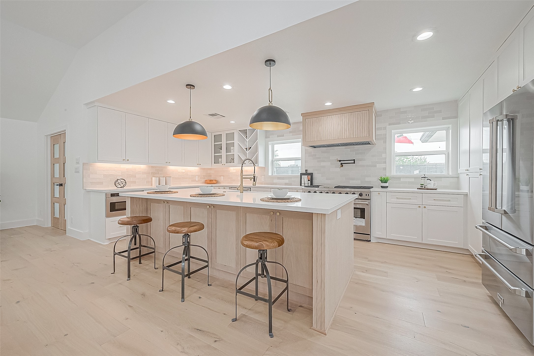 6254 Locke Lane Houston, TX 77057 - Photo 17 of 44 a kitchen with a sink cabinets and window