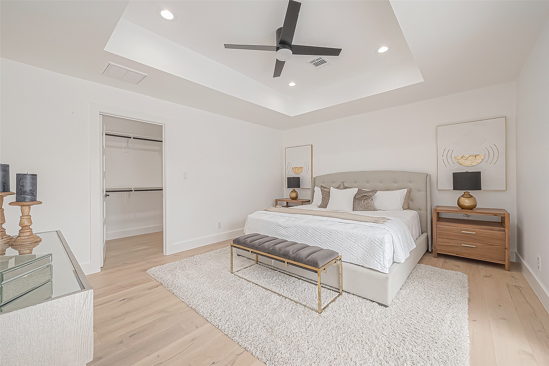 6254 Locke Lane Houston, TX 77057 - Photo 18 of 44 a bedroom with a bed and a chandelier