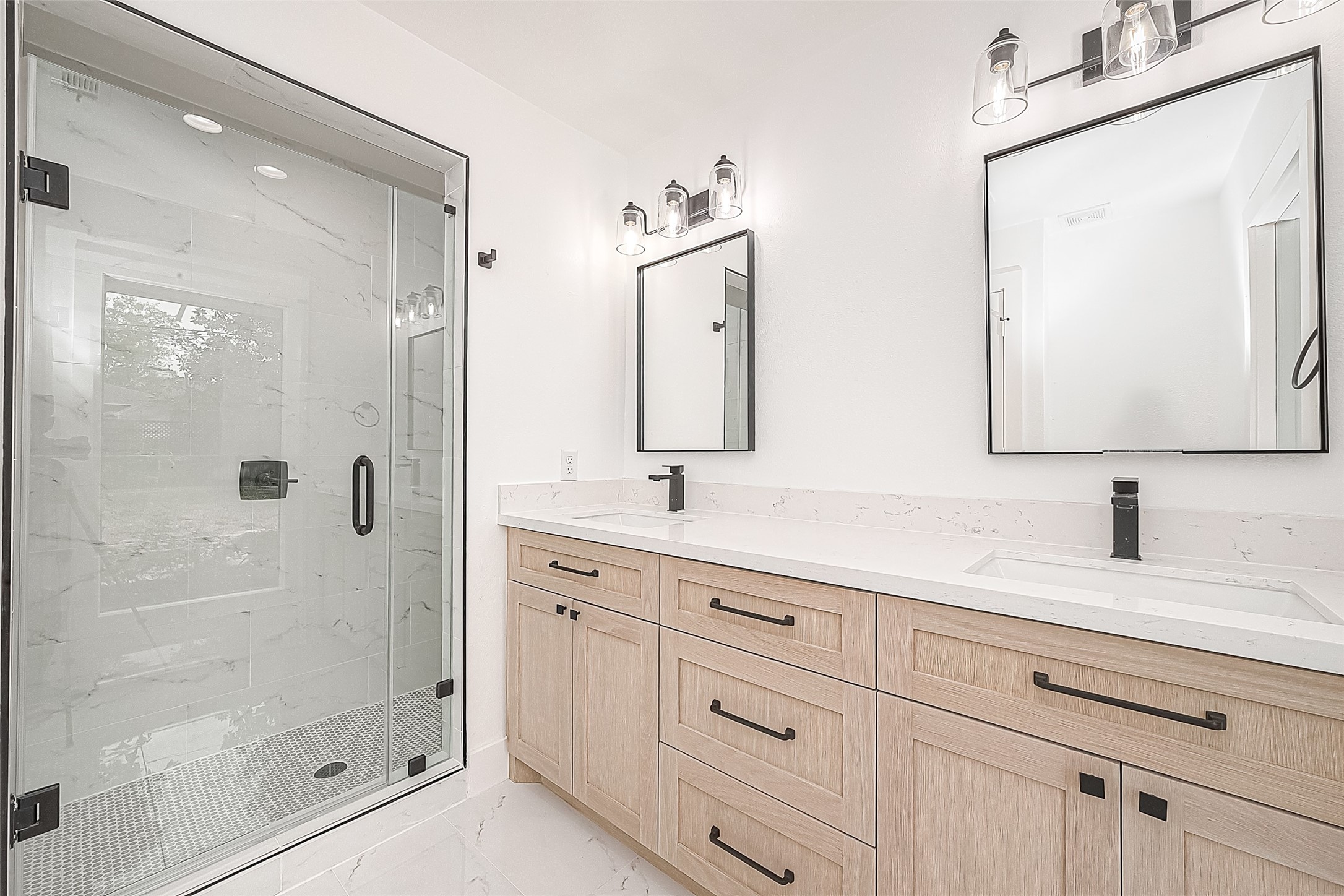 6254 Locke Lane Houston, TX 77057 - Photo 33 of 44 a bathroom with a double vanity sink mirror and shower