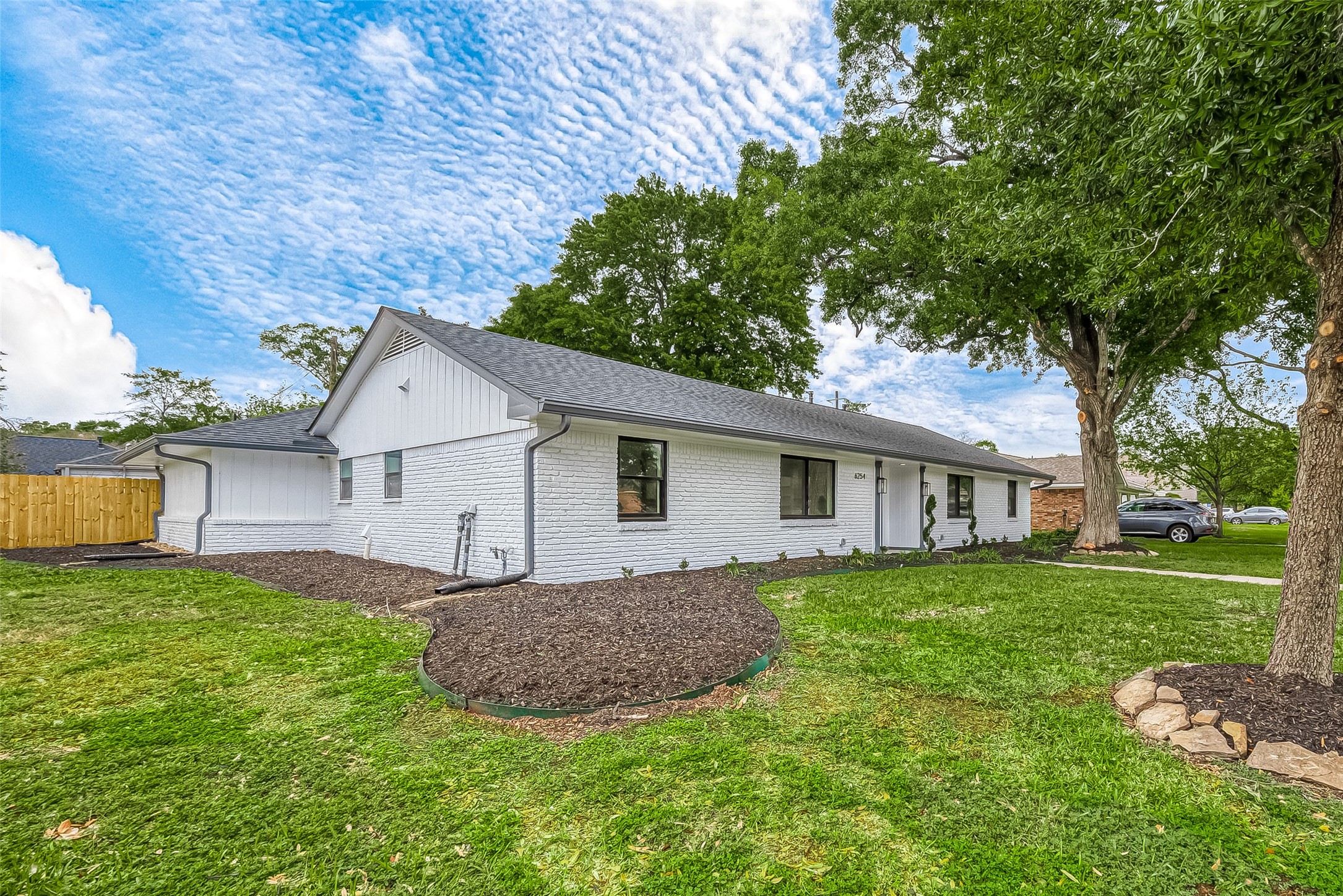 6254 Locke Lane Houston, TX 77057 - Photo 43 of 44 front view of a house with a yard