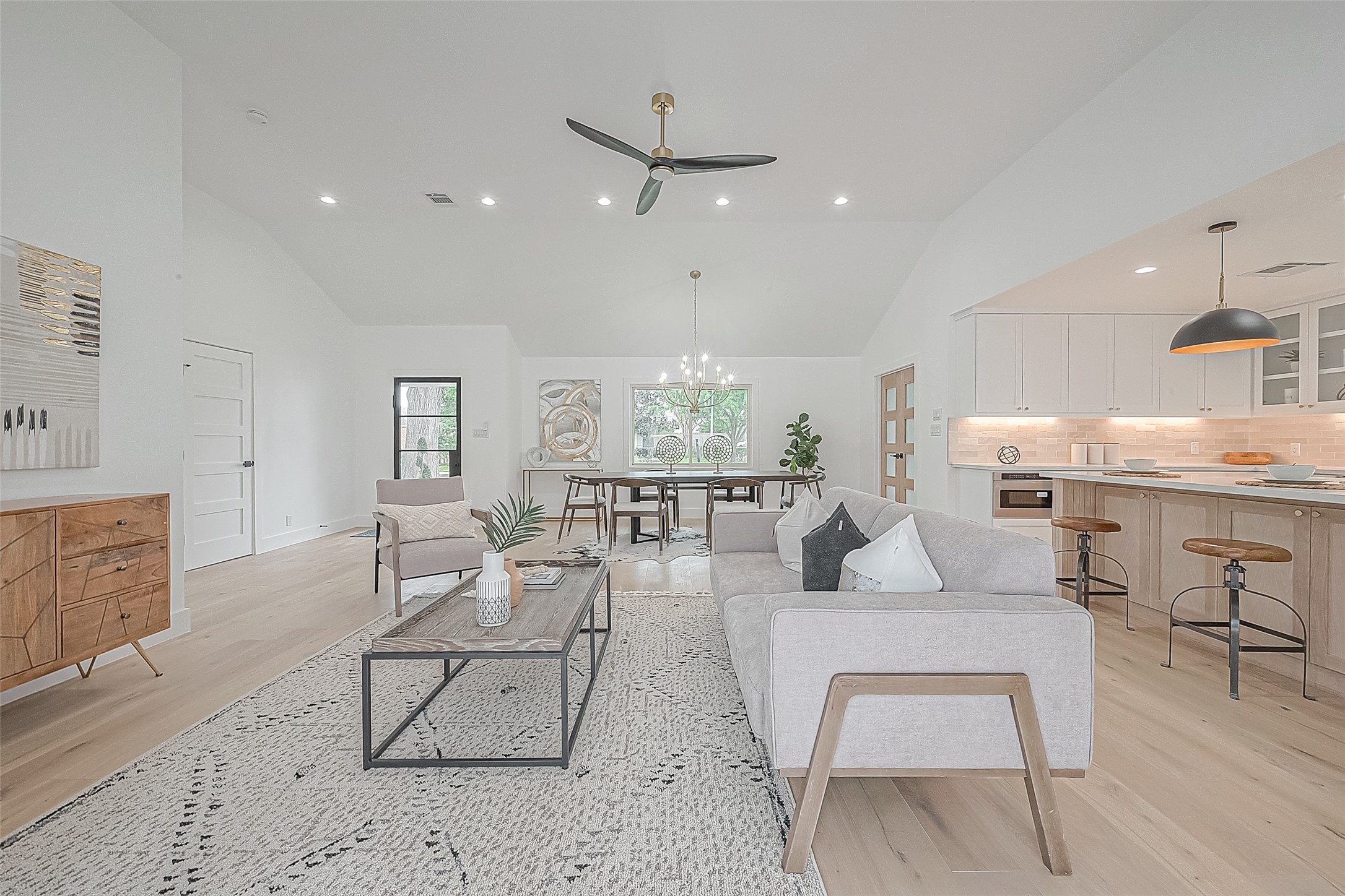 6254 Locke Lane Houston, TX 77057 - Photo 5 of 44 a living room with furniture and a chandelier