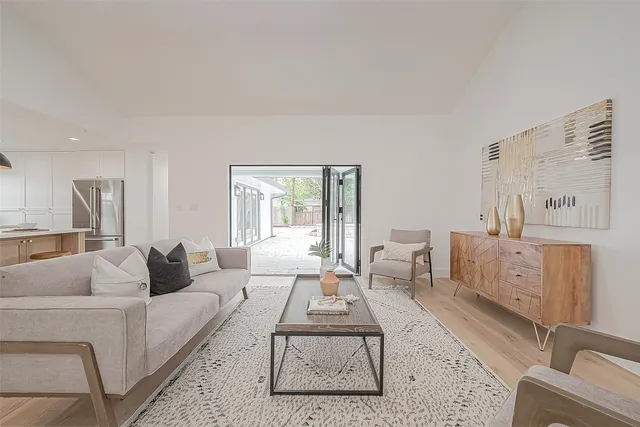 a kitchen with a sink and chairs