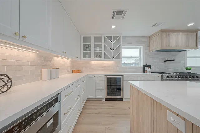 a kitchen with a stove and a refrigerator
