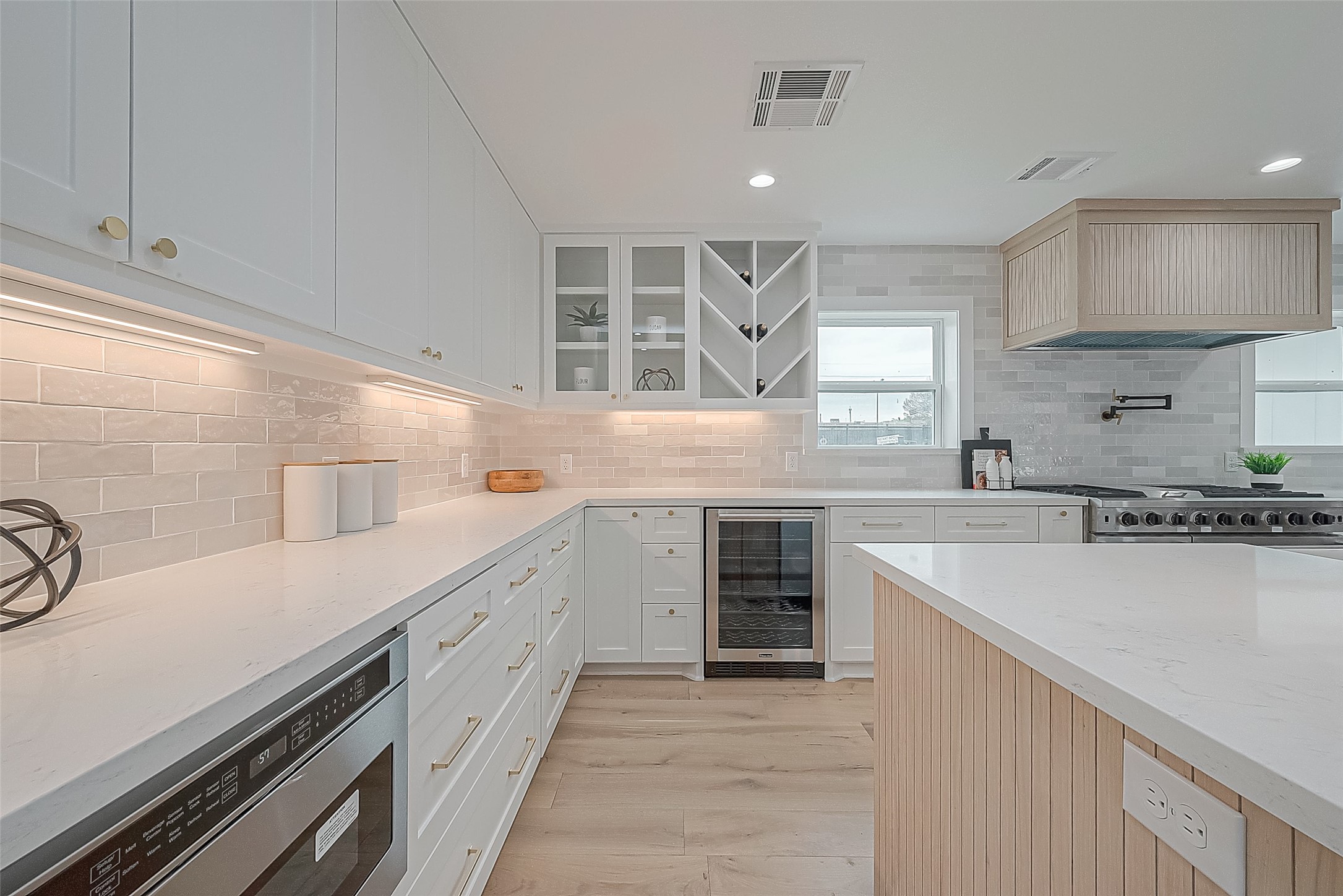 6254 Locke Lane Houston, TX 77057 - Photo 10 of 44 a kitchen with a sink stove and cabinets
