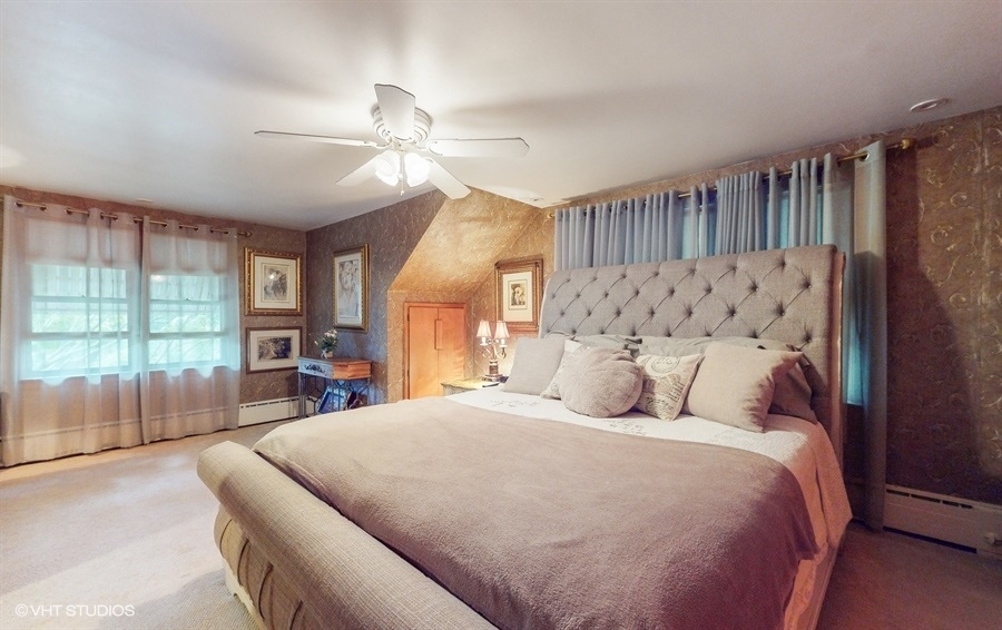 633 Oakland Avenue Elgin, IL 60120 - Photo 16 of 35 a bedroom with a large bed and a large window