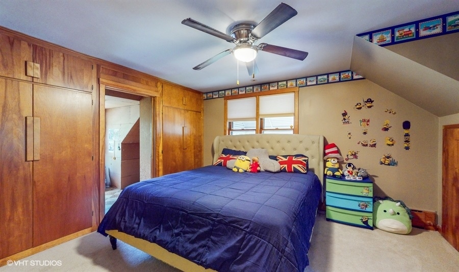 633 Oakland Avenue Elgin, IL 60120 - Photo 17 of 35 a bedroom with a bed and a window