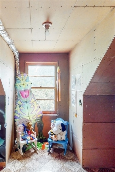 633 Oakland Avenue Elgin, IL 60120 - Photo 20 of 35 a bedroom with furniture and a window