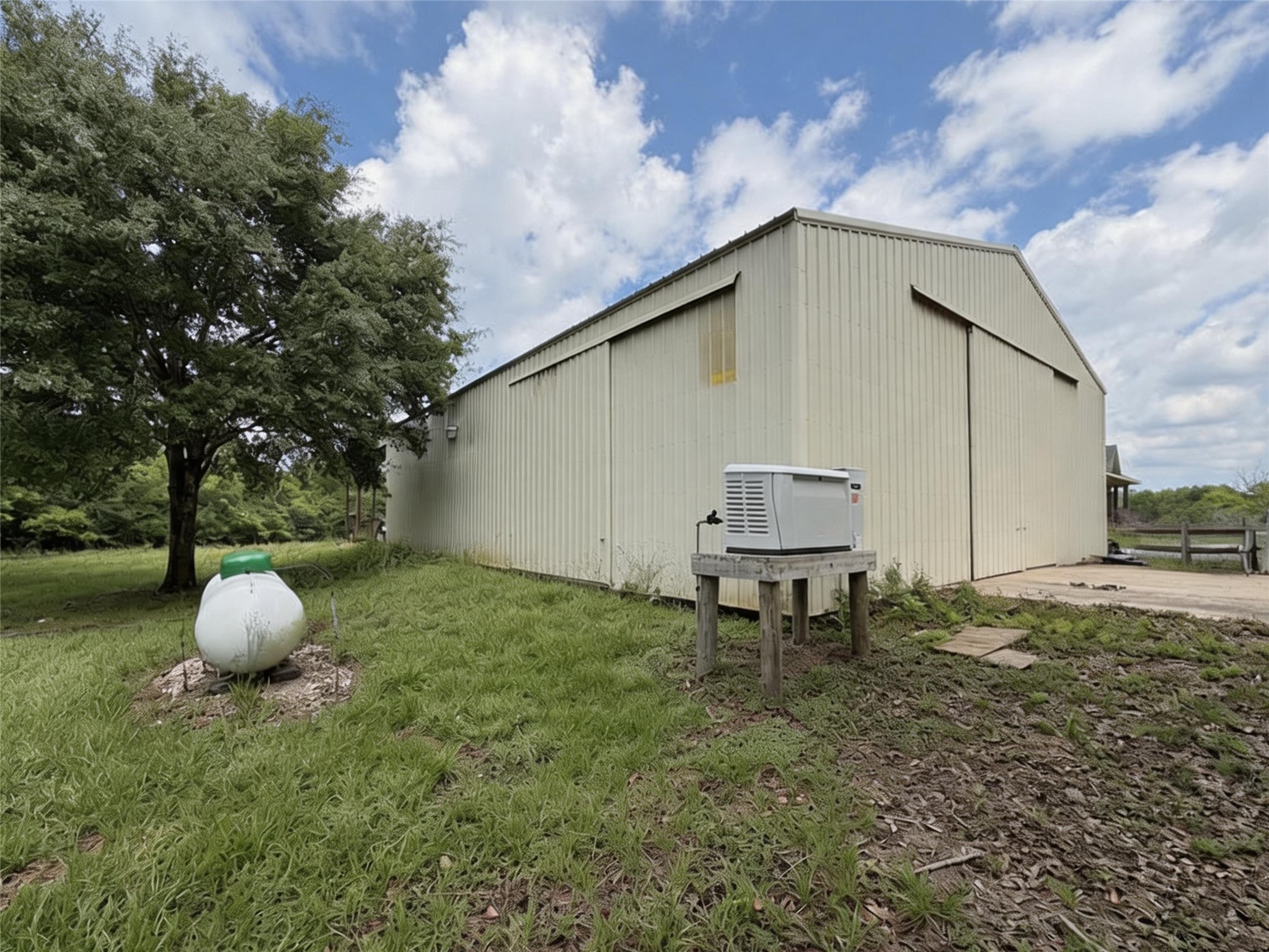 4680 County Road 611 Angleton, TX 77515 - Photo 2 of 9 a backyard of a house with table and chairs