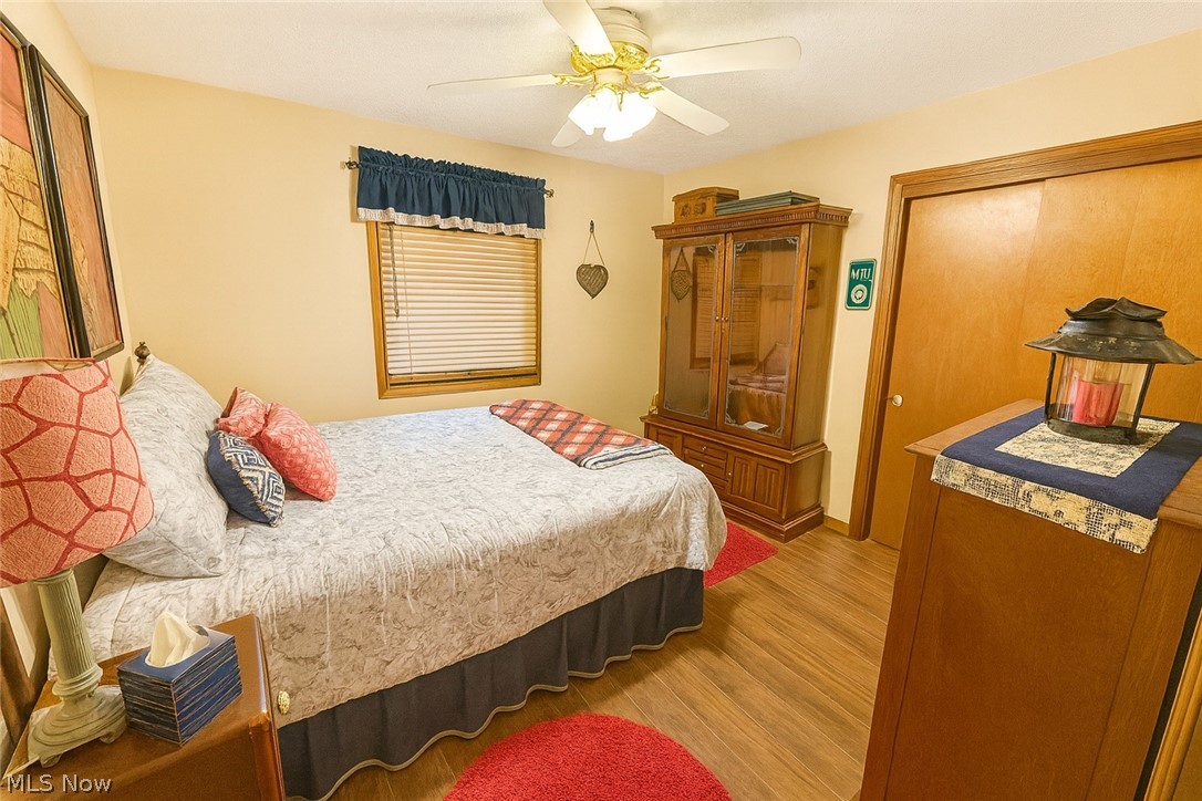 53310 Mud Run Road Senecaville, OH 43780 - Photo 10 of 28 Bedroom 2 featuring double closet and ceiling fan