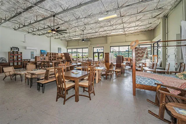 a living room with lots of furniture and a chandelier