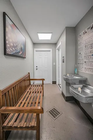 a bedroom with furniture and a rug