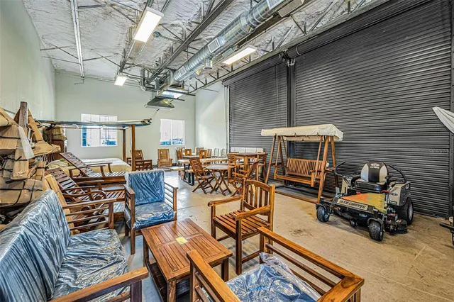 a living room with lots of furniture and a chandelier