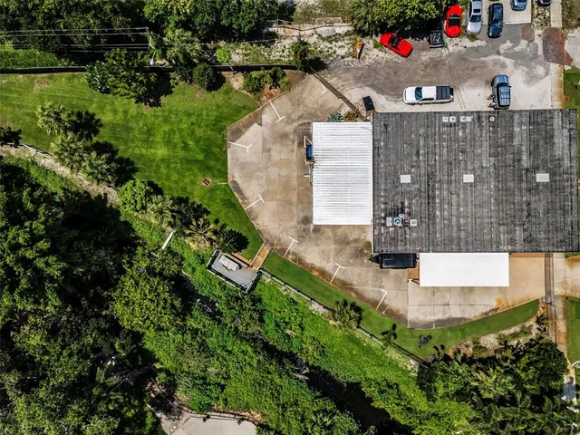 an aerial view of a house with outdoor space and street view