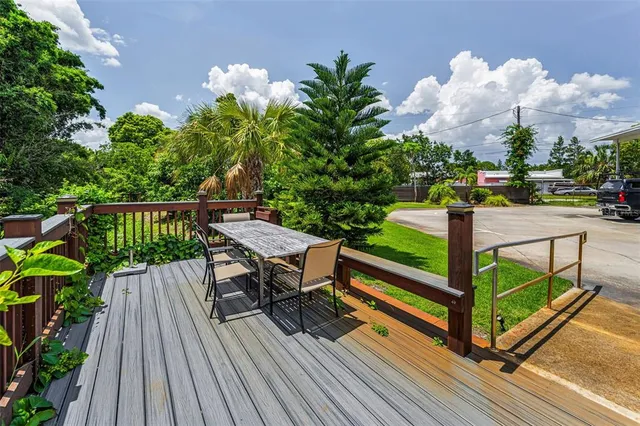 a view of a deck with furniture