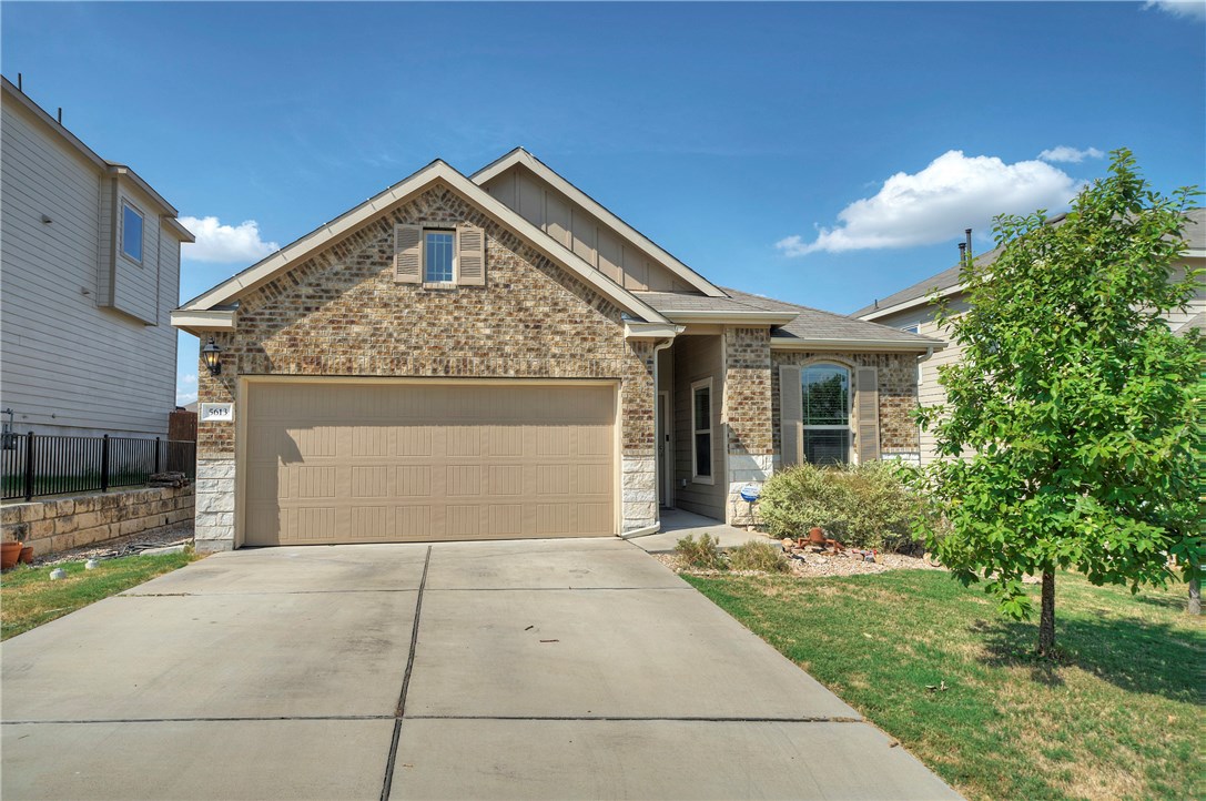a front view of a house with yard