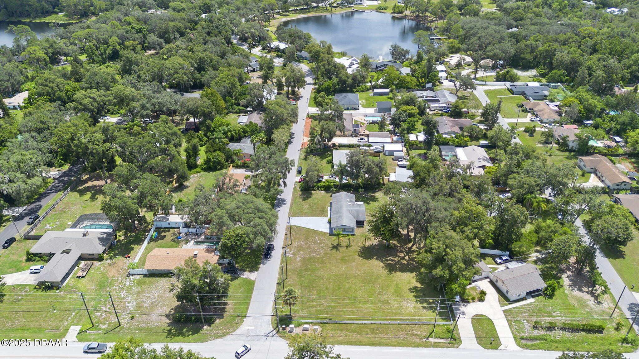 2202 Lake Ruby Road DeLand, FL 32724 - Photo 13 of 13 an aerial view of residential houses with outdoor space and trees