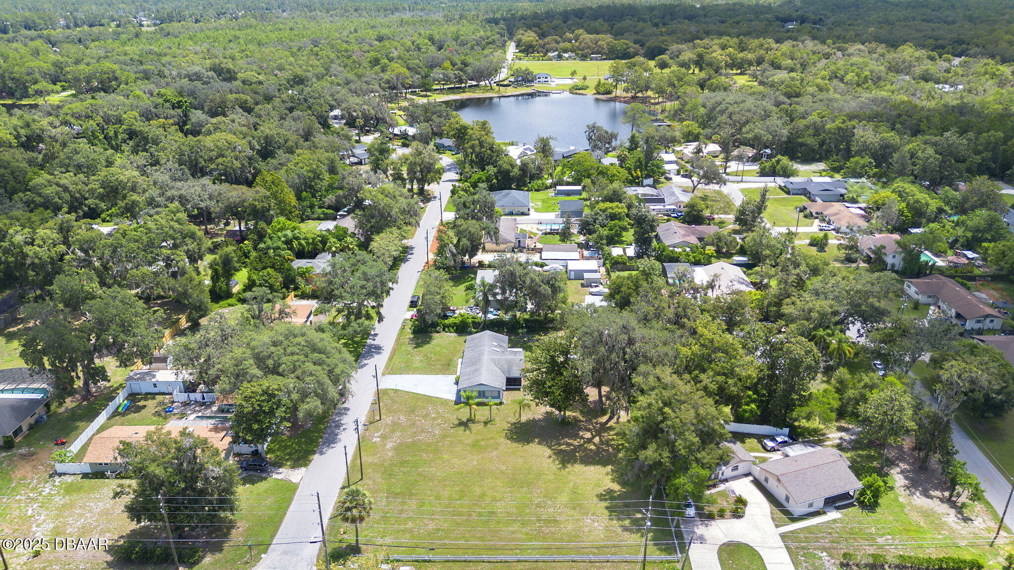 2202 Lake Ruby Road DeLand, FL 32724 - Photo 2 of 13 an aerial view of residential houses with outdoor space and trees