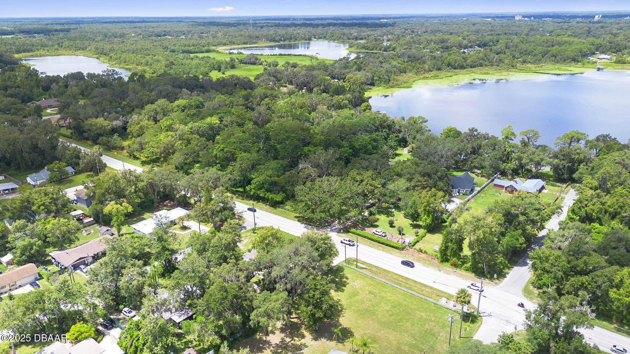 2202 Lake Ruby Road DeLand, FL 32724 - Photo 4 of 13 a view of a lake from a yard