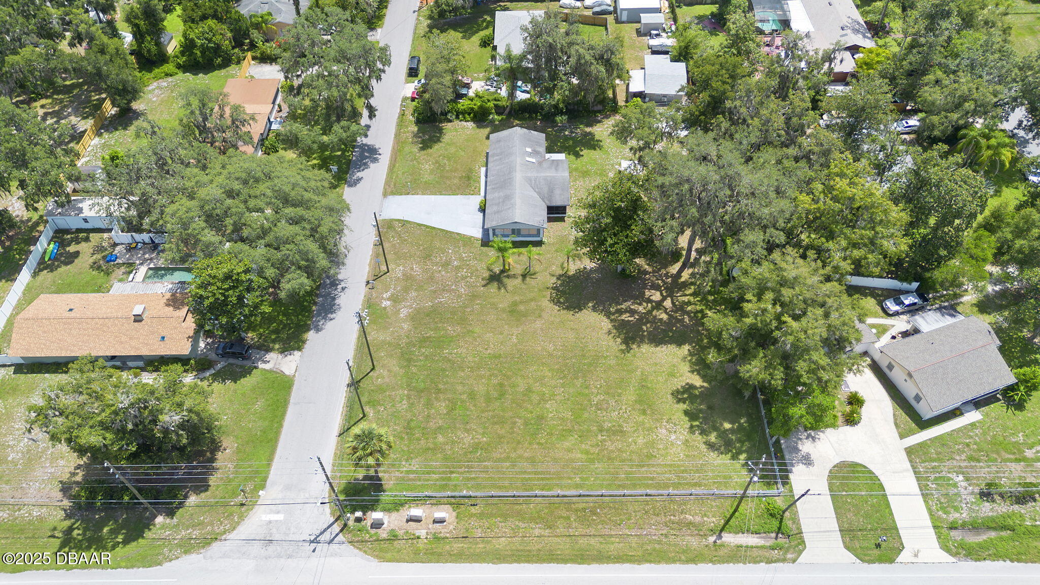 2202 Lake Ruby Road DeLand, FL 32724 - Photo 8 of 13 an aerial view of a residential houses with yard