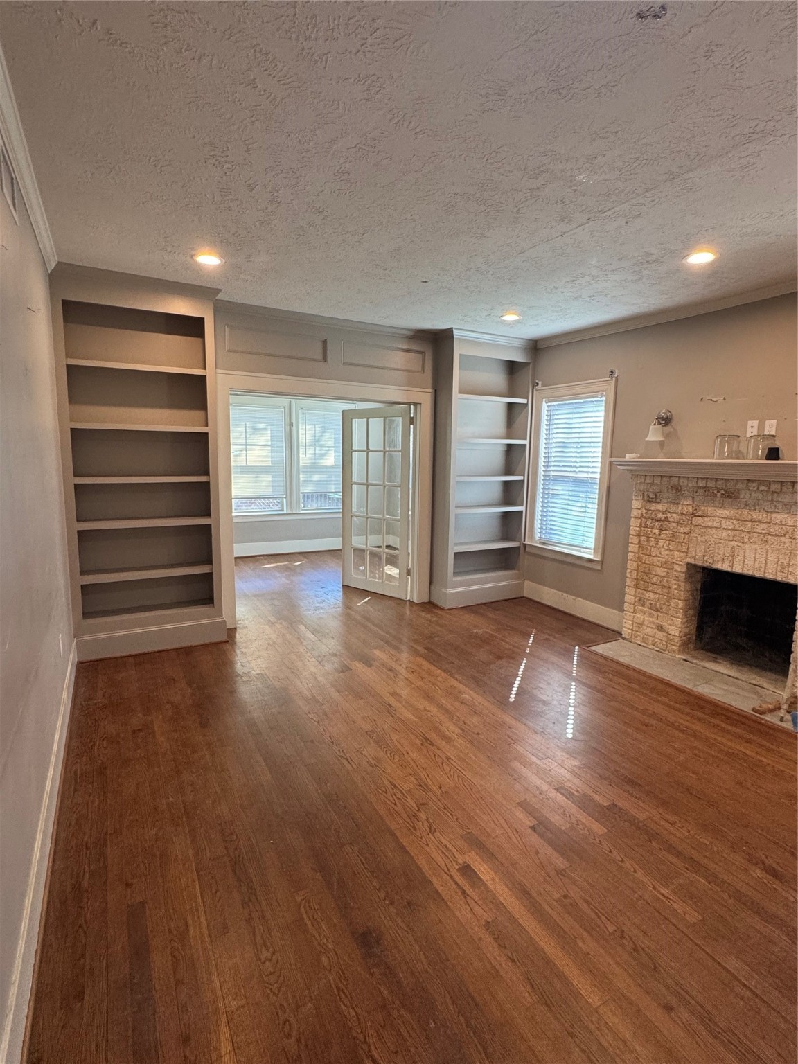 2307 Arbor Street, Unit 1 Houston, TX 77004 - Photo 3 of 11 a view of a room with wooden floor and fireplace