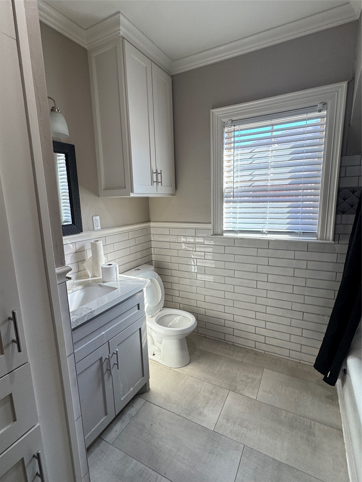 2307 Arbor Street, Unit 1 Houston, TX 77004 - Photo 7 of 11 a bathroom with a toilet sink and mirror