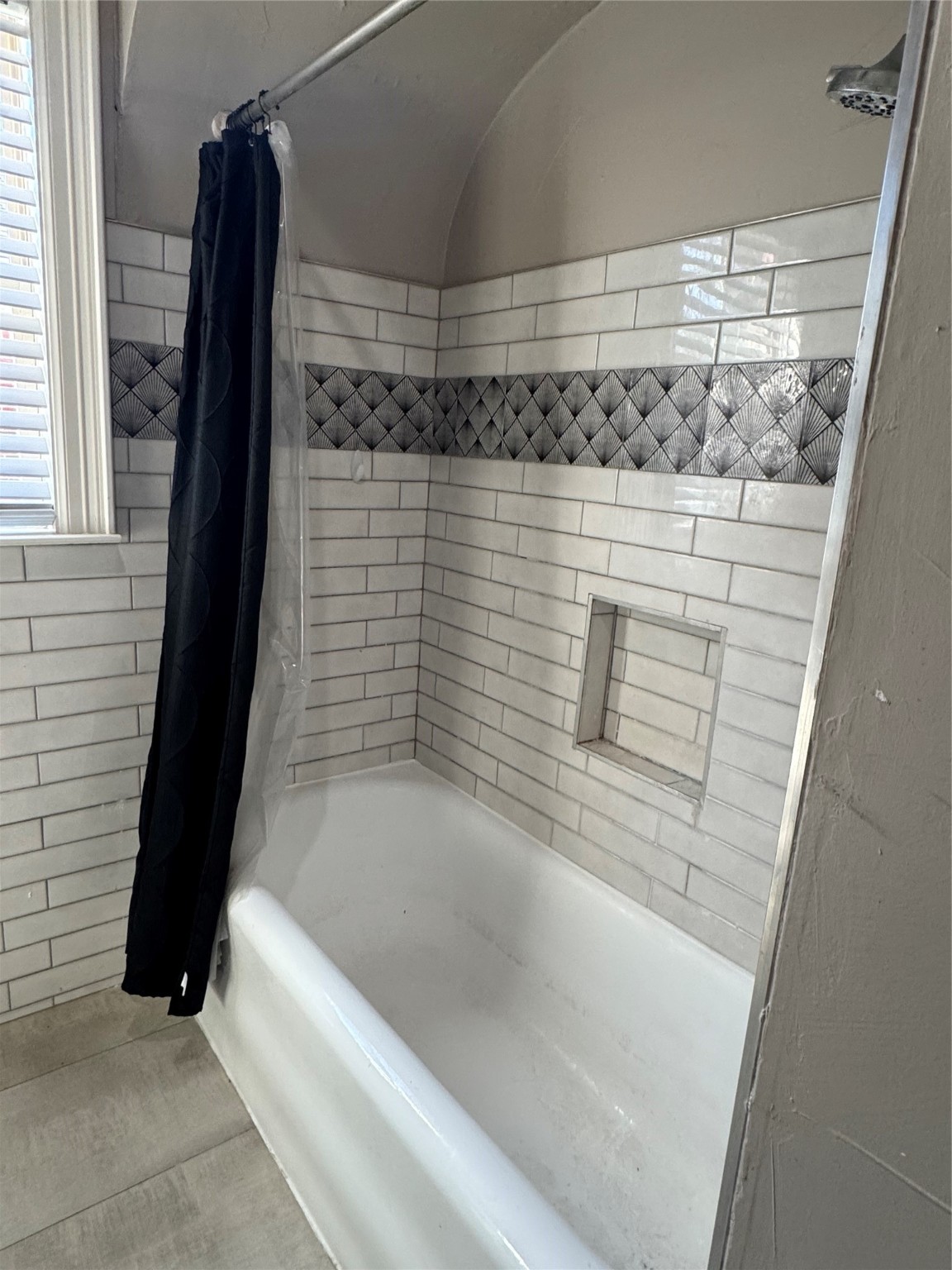 2307 Arbor Street, Unit 1 Houston, TX 77004 - Photo 8 of 11 a bathroom with a bathtub