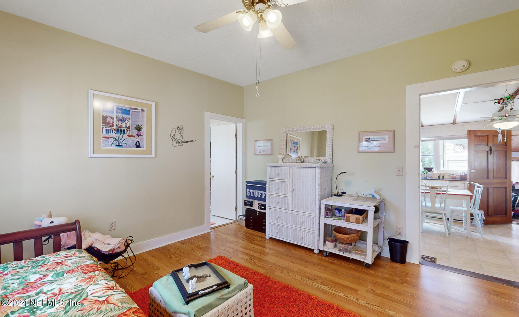 134 East End Road San Mateo, FL 32187 - Photo 14 of 45 a bedroom with furniture and a wooden floor