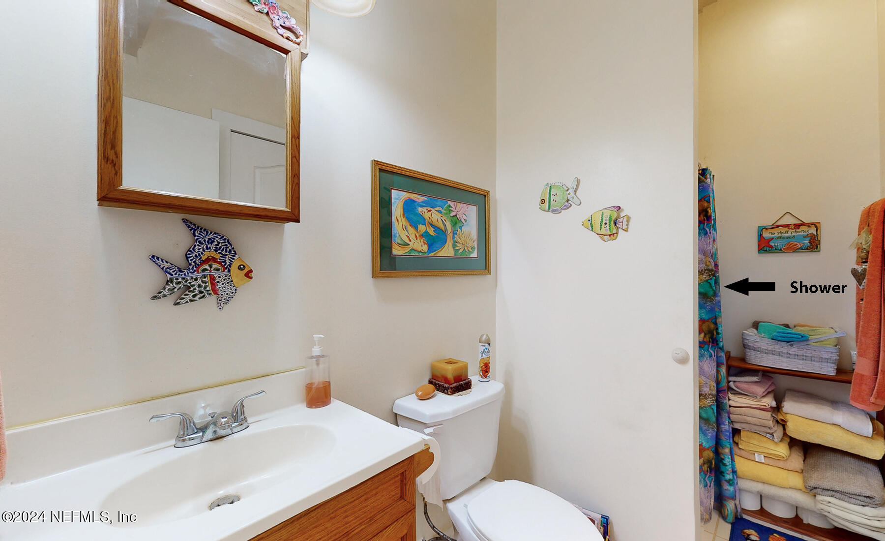 134 East End Road San Mateo, FL 32187 - Photo 15 of 45 a bathroom with a sink mirror vanity and toilet