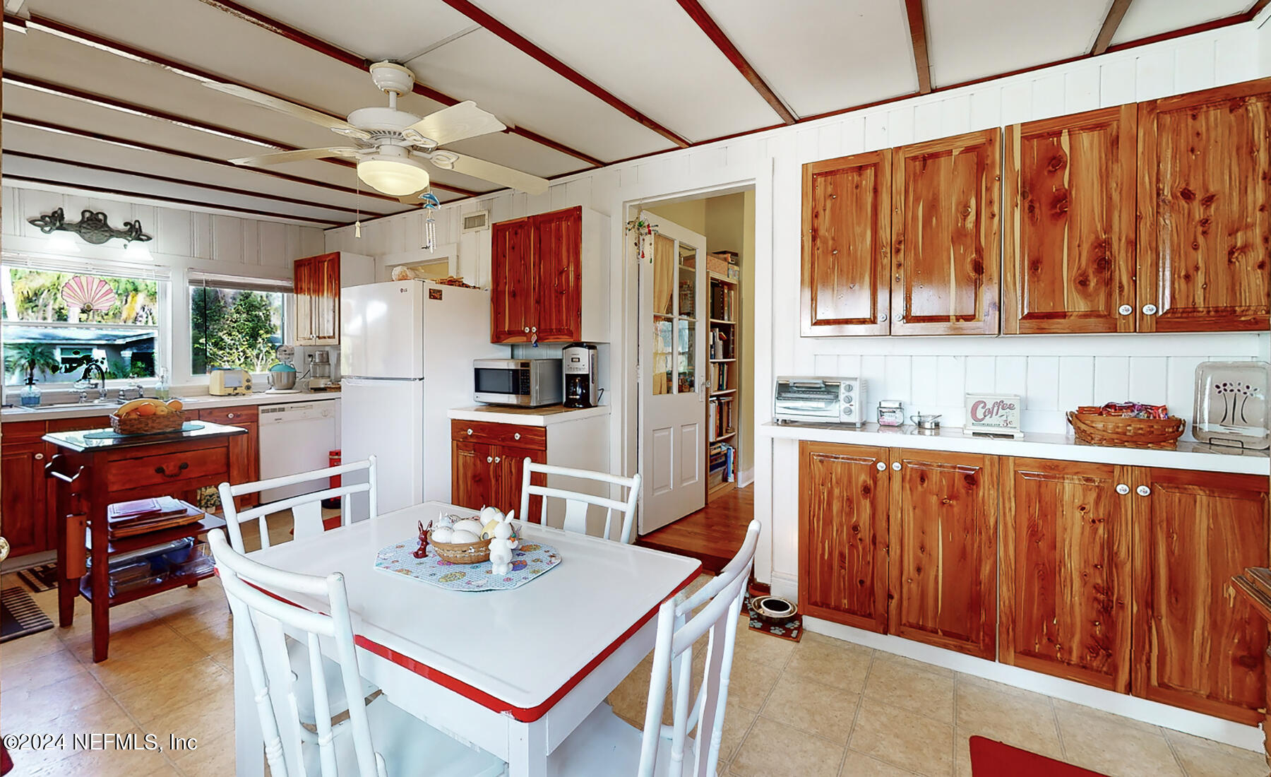 134 East End Road San Mateo, FL 32187 - Photo 16 of 45 a open kitchen with stainless steel appliances granite countertop a sink dishwasher and a refrigerator with wooden cabinets