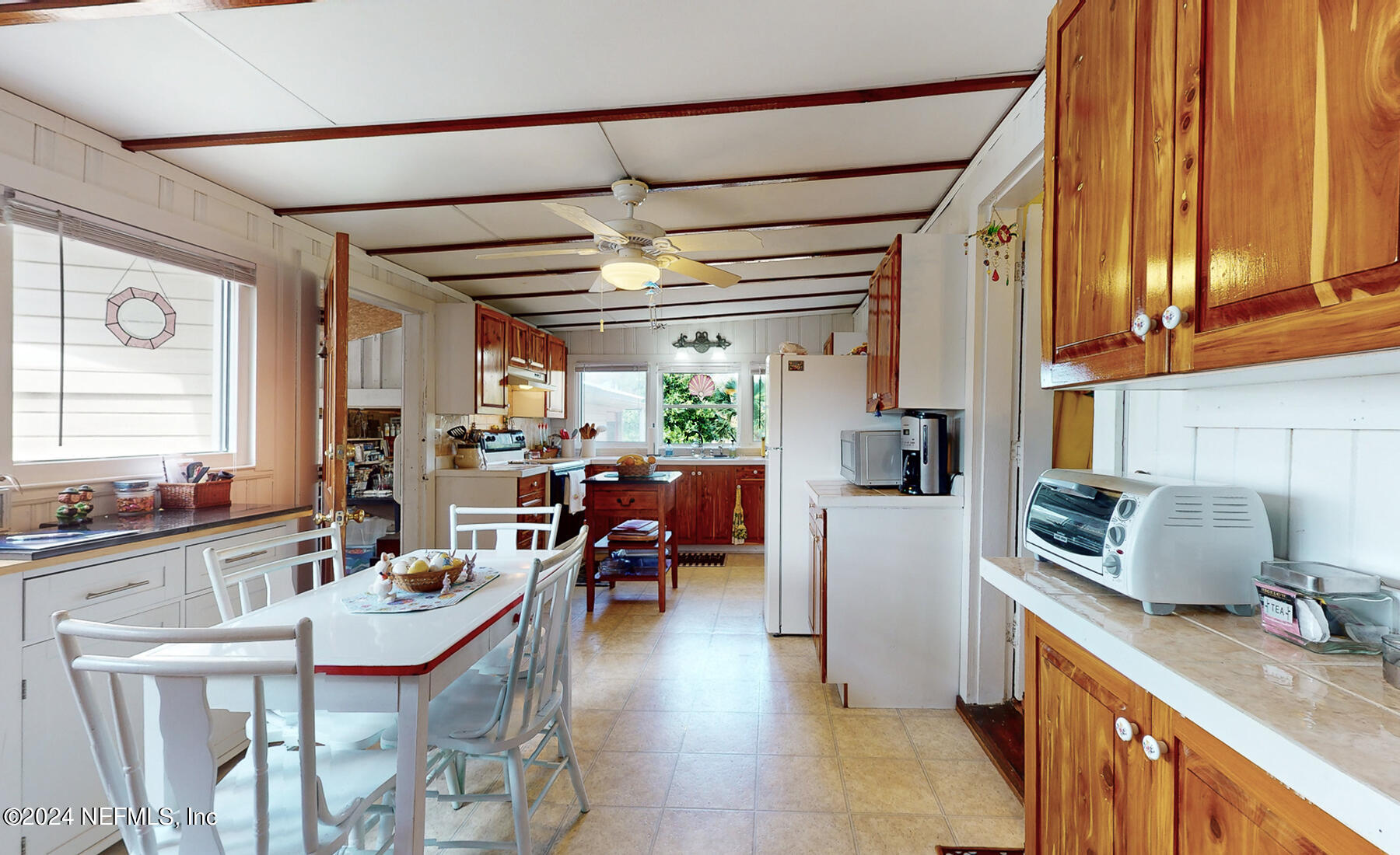 134 East End Road San Mateo, FL 32187 - Photo 17 of 45 a kitchen with kitchen island granite countertop a sink appliances cabinets and furniture