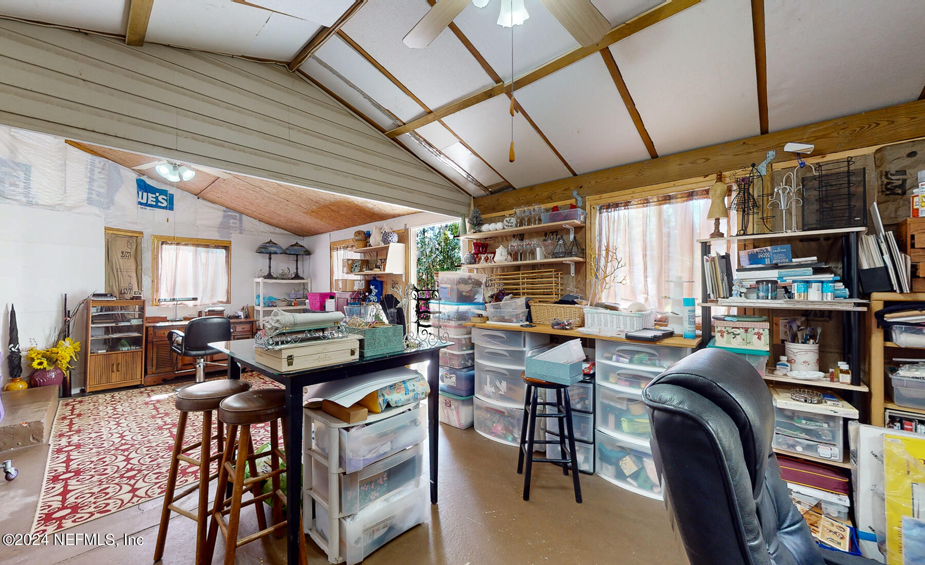 134 East End Road San Mateo, FL 32187 - Photo 24 of 45 a view of a livingroom with furniture and a bookshelf