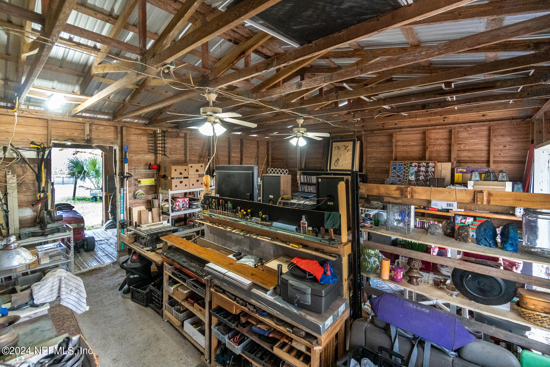 134 East End Road San Mateo, FL 32187 - Photo 30 of 45 a room with lots of furniture and clutter