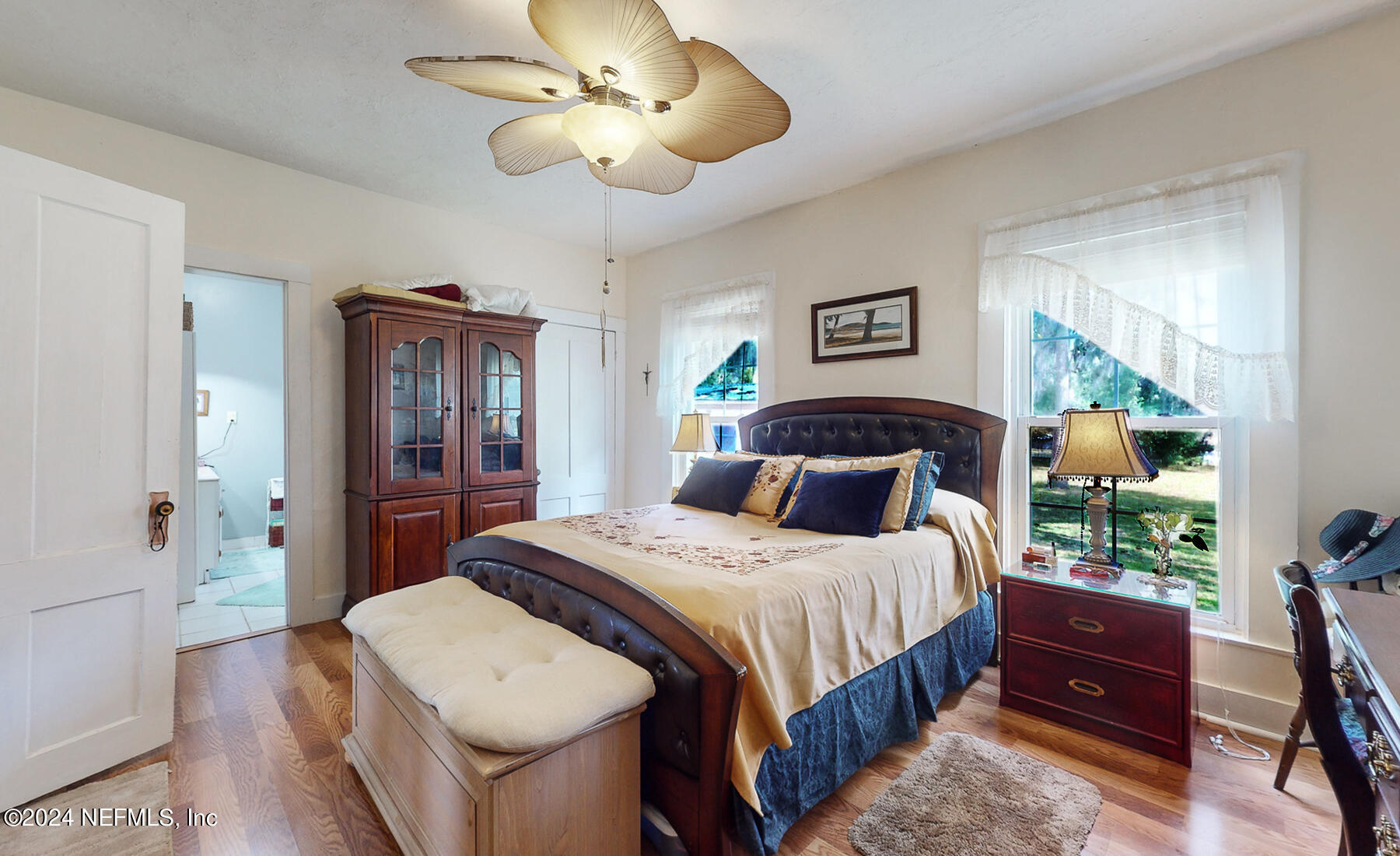 134 East End Road San Mateo, FL 32187 - Photo 7 of 45 a bedroom with a bed and a chandelier