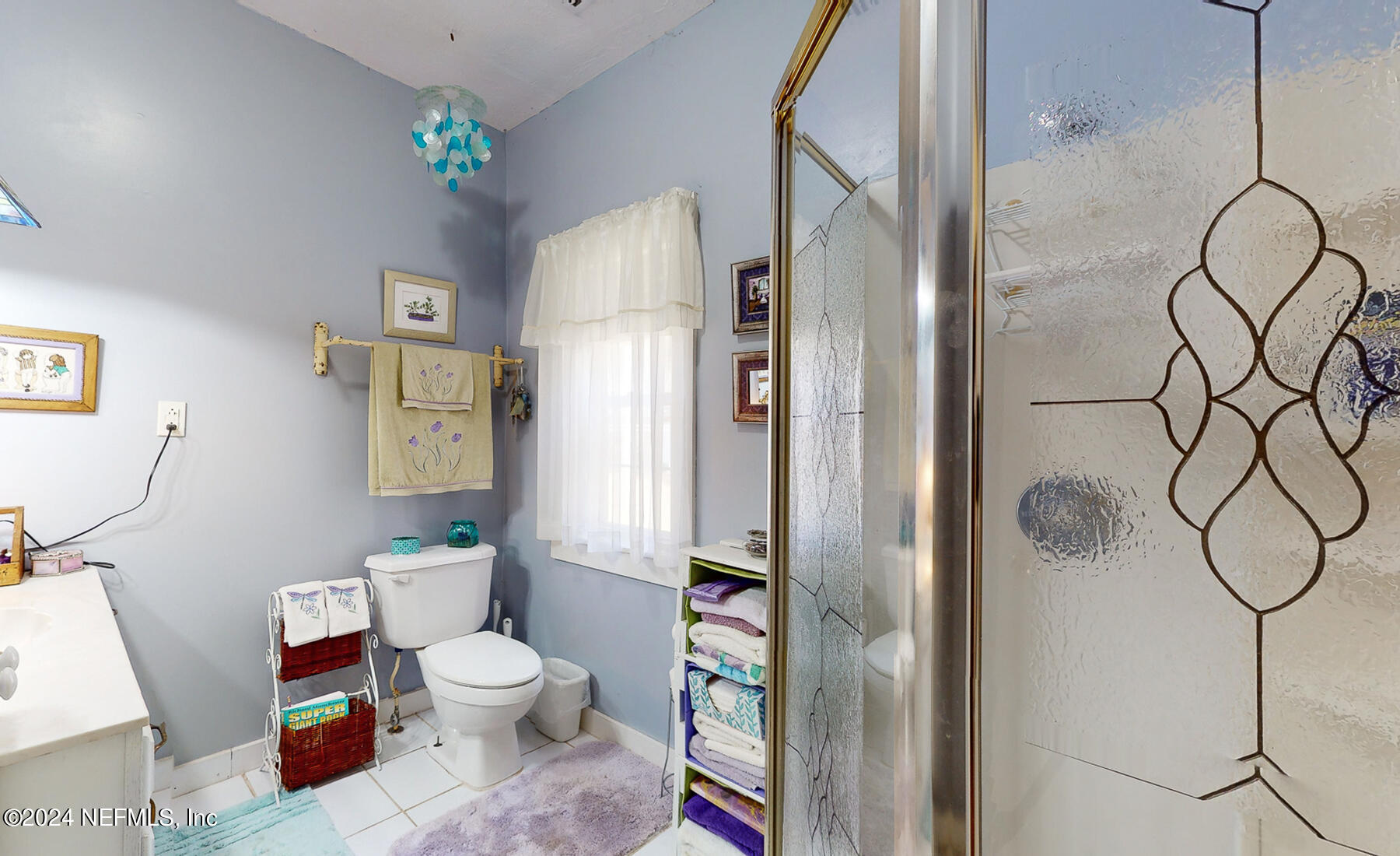 134 East End Road San Mateo, FL 32187 - Photo 9 of 45 a bathroom with a toilet and a shower