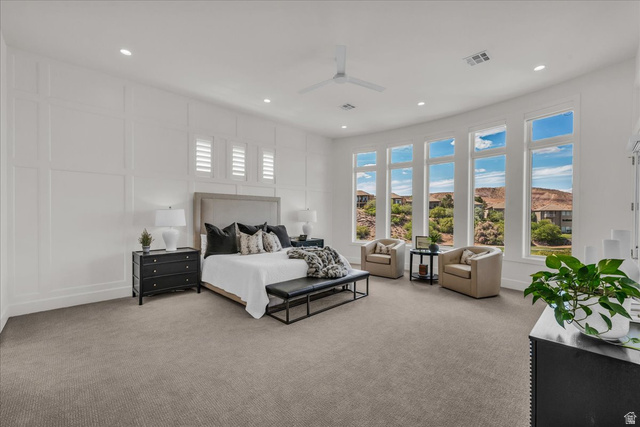 2608 Canyon Ridge Drive St. George, UT 84770 - Photo 30 of 86 Primary bedroom featuring five tall windows with white framing, recessed lighting, and a white ceiling fan