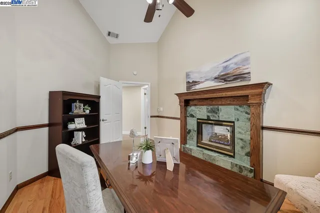 a view of kitchen and hallway with wooden floor