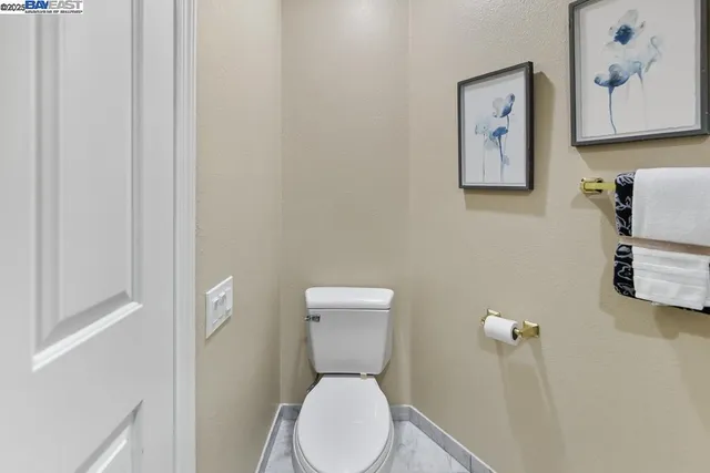 an outdoor sitting area with furniture and plants