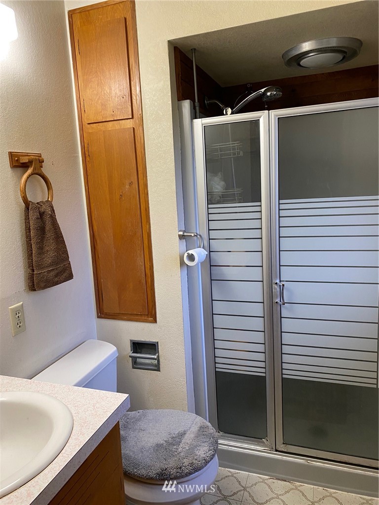 19147 Old Highway 99 Southwest Rochester, WA 98579 - Photo 16 of 27 a bathroom with a sink and a mirror