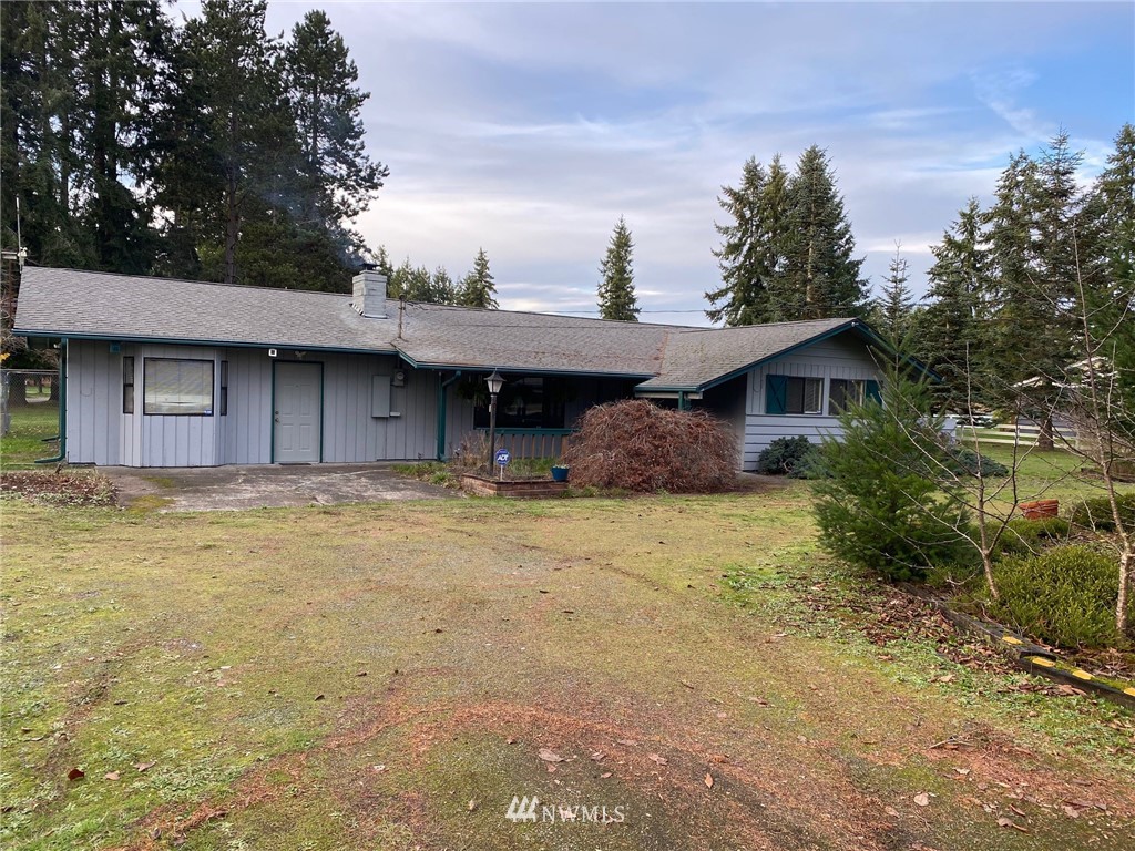 19147 Old Highway 99 Southwest Rochester, WA 98579 - Photo 3 of 27 a front view of a house with a garden