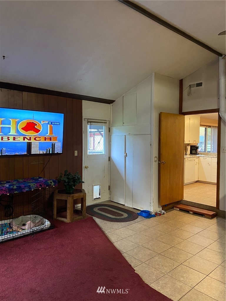 19147 Old Highway 99 Southwest Rochester, WA 98579 - Photo 23 of 27 a bedroom with furniture and a flat screen tv