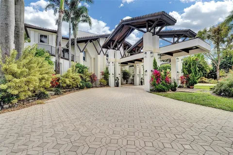 a living room with furniture chandelier and a large window