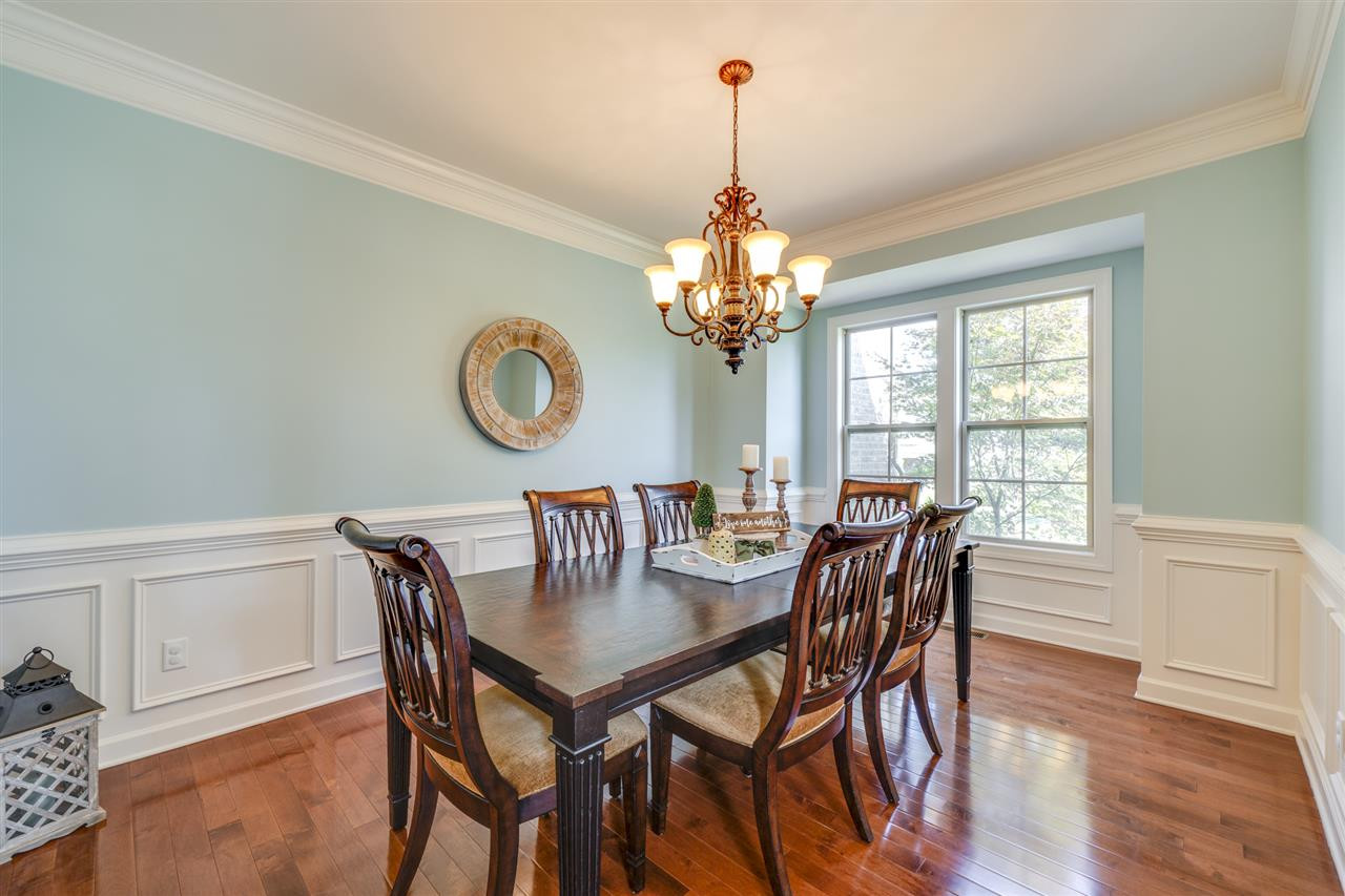 401 Rensford Place Cary, NC 27513 - Photo 6 of 30 Wood floors, crown molding, chair rail & wainscoting Dining Room