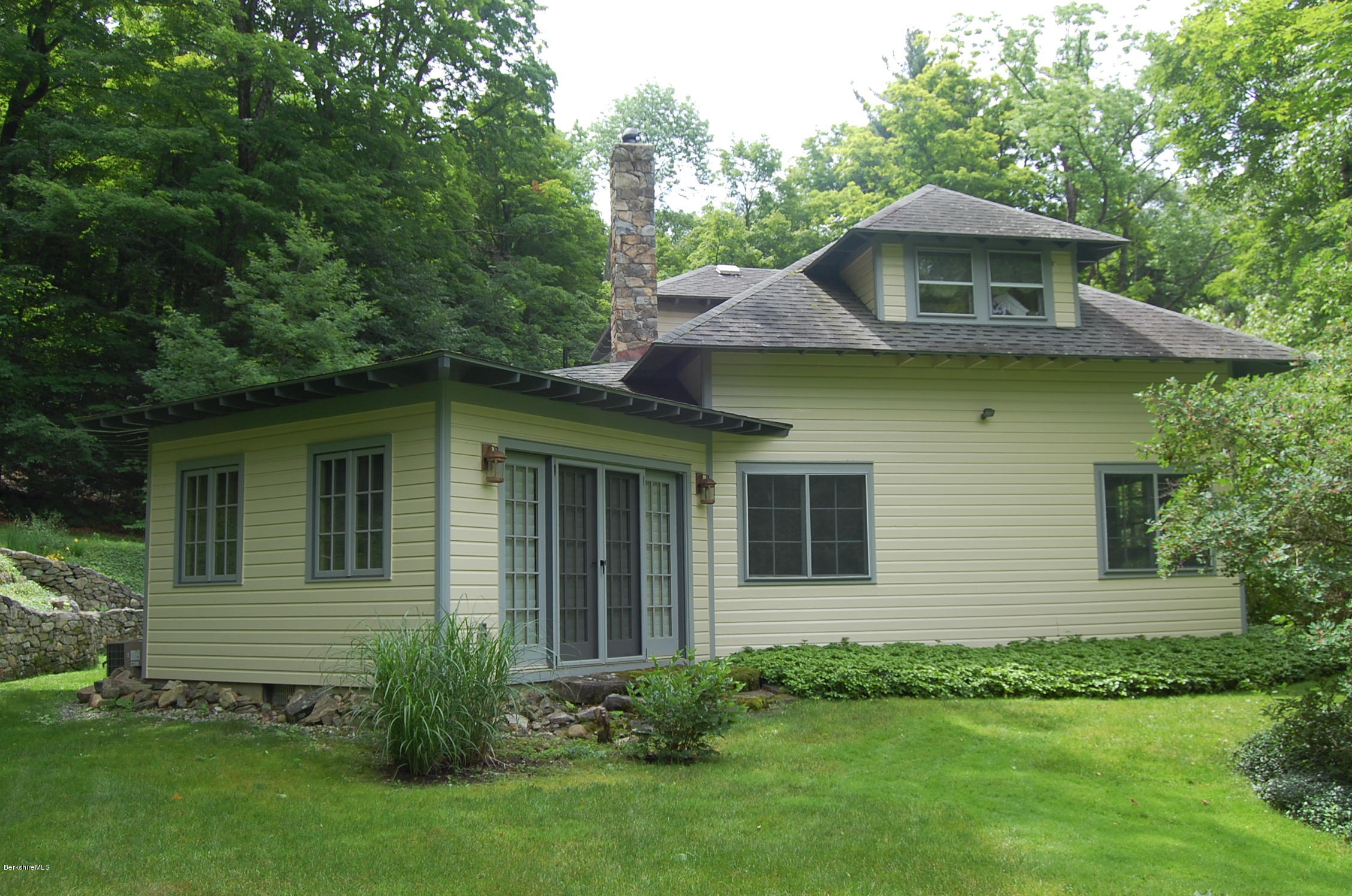 53 Reservoir Road Richmond, MA 01254 - Photo 3 of 37 a front view of a house with a garden