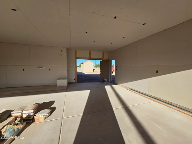 a hallway with a large white bed