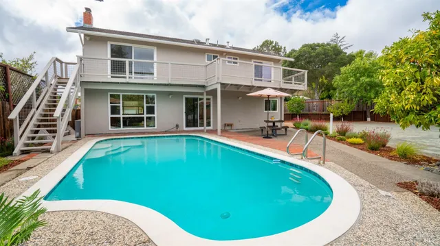 a view of a house with swimming pool