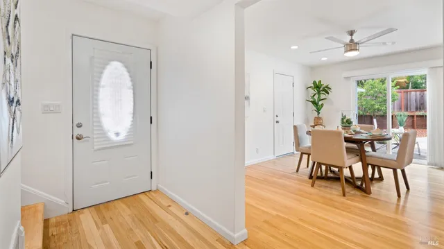a view of a dining room with furniture window and wooden floor