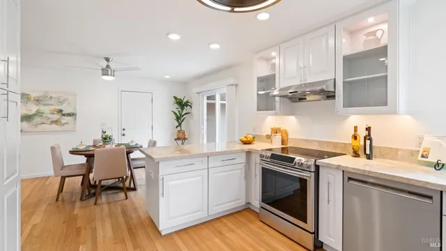 a kitchen with a stove a sink and a refrigerator
